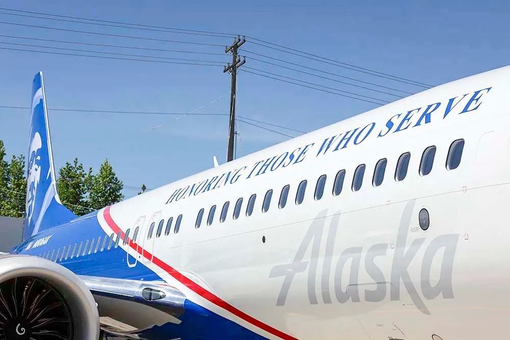 Side of the fuselage of the Alaska Airlines Boeing 737 MAX 8 Honoring Those Who Serve Aircraft