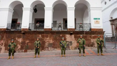 Reuters Soldiers stand guard outside the presidential palace following a wave of violence around the nation, prompting President Daniel Noboa to declare gangs to be terrorist organisations to be hunted by the military, in Quito, Ecuador January 10, 2024.