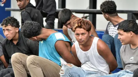 Reuters Police officers (not pictured) present the detainees who stormed the TC Television studio during a live TV broadcast amid an ongoing wave of violence around the nation, in Guayaquil, Ecuador January 10, 2024.