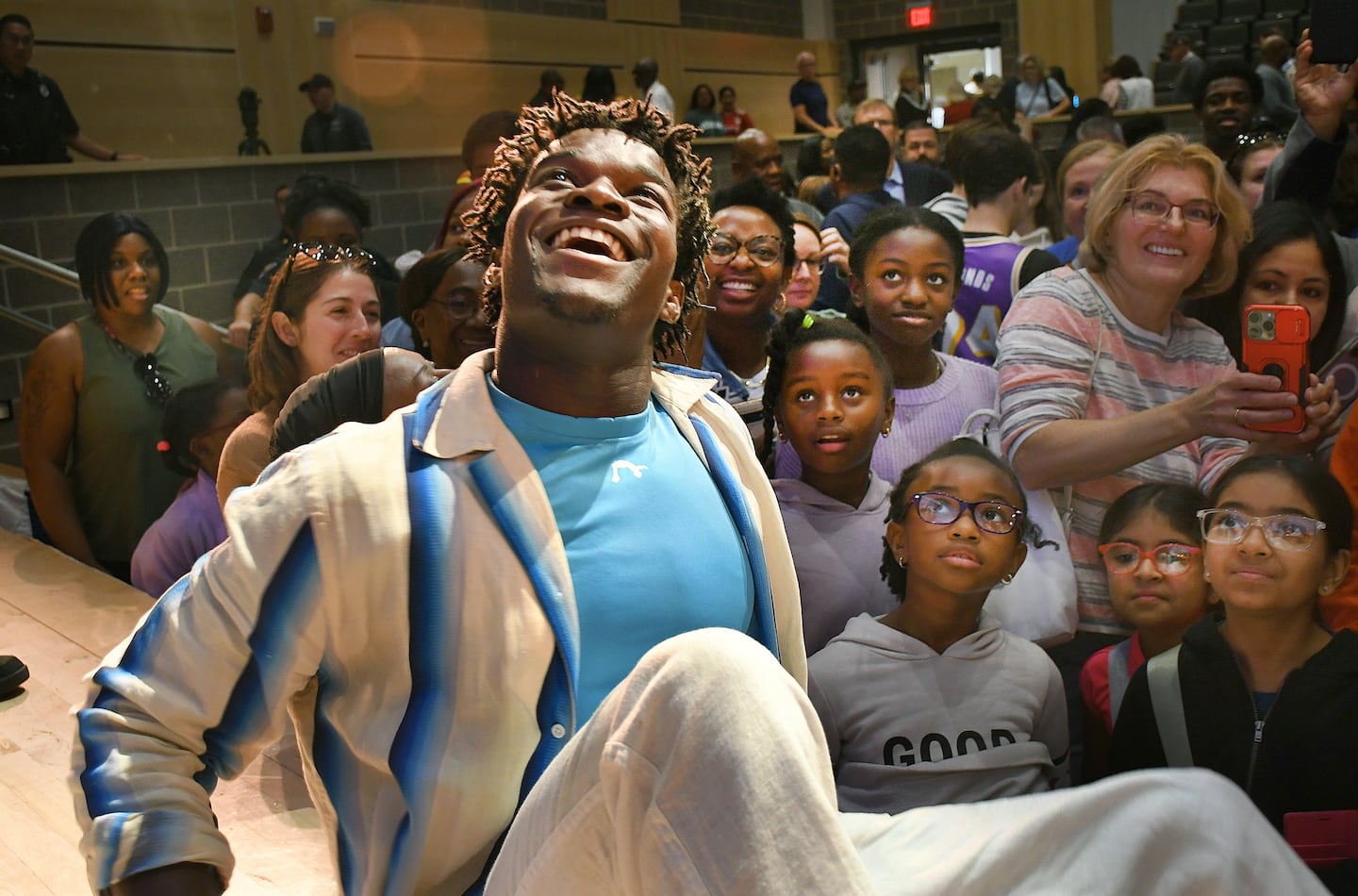 The Town of Stoughton held a celebration Sunday at Stoughton High School for hometown Olympian Frederick Richard. The gymnast sat on the edge of the stage while signing autographs. 