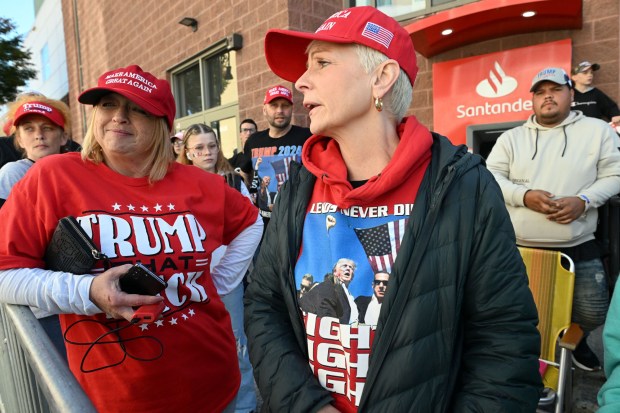 Michele Nissley of Exeter Township, left, and Renee Royer of Sinking Spring are supporters of former President Donald J. Trump. They wait outside before his speech Wednesday, Oct. 9, 2024 at the Santander Arena in Reading. (BILL UHRICH/READING EAGLE)