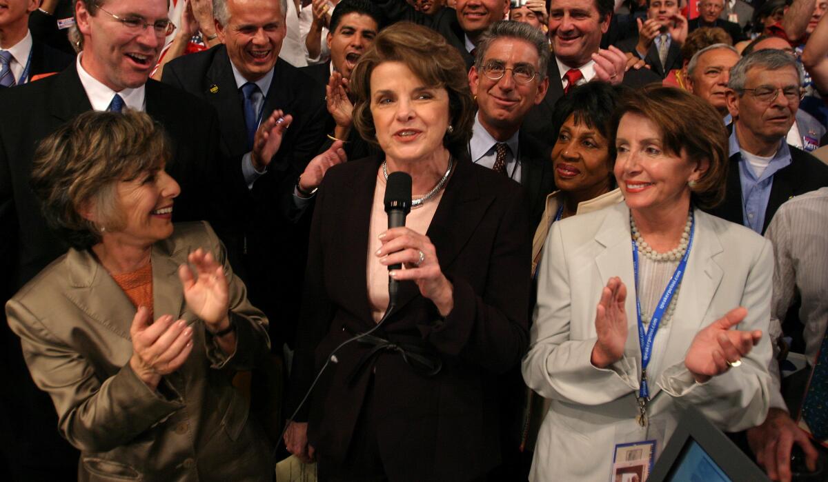 Three women in a crowd of convention-goers.