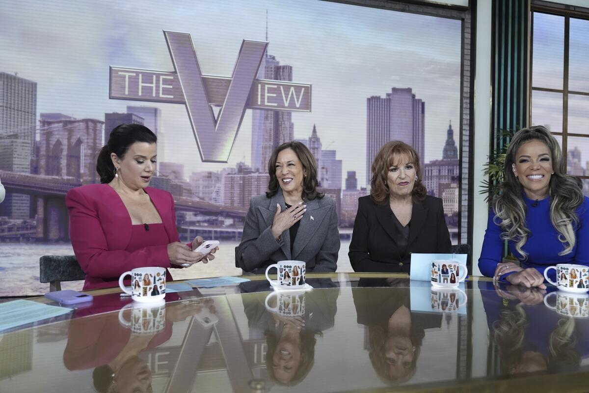 Four women on the set of the TV show 