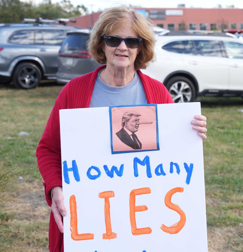 Retired Scranton teacher Barb O’Malley was holding a placard ­outside the sports centre rally ­labelling Trump a liar