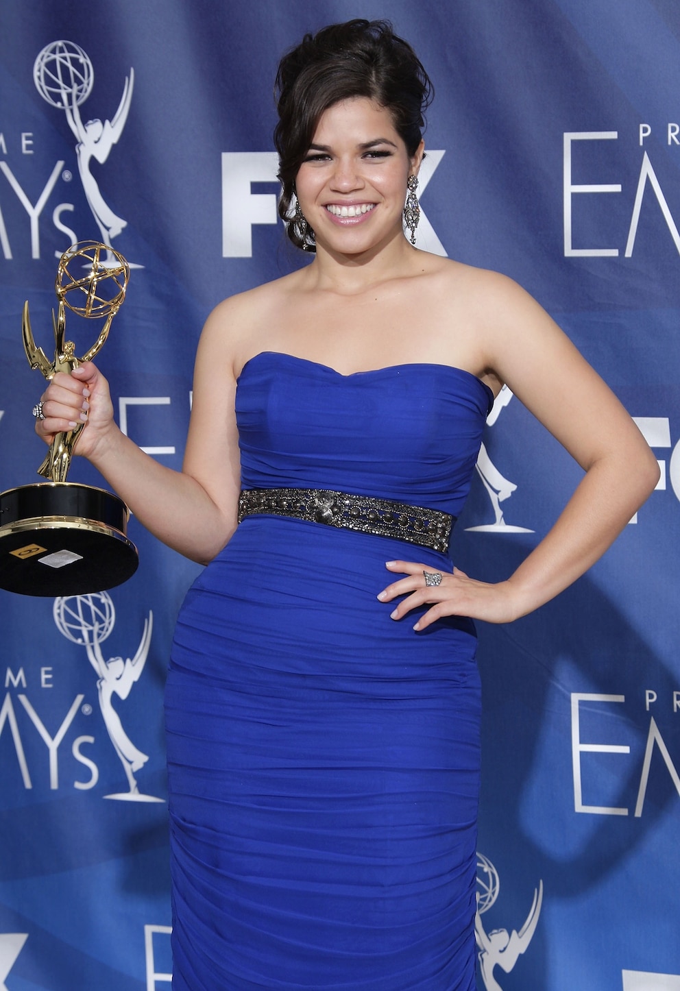 PHOTO: Actress America Ferrera poses in the pressroom with her Emmy for 