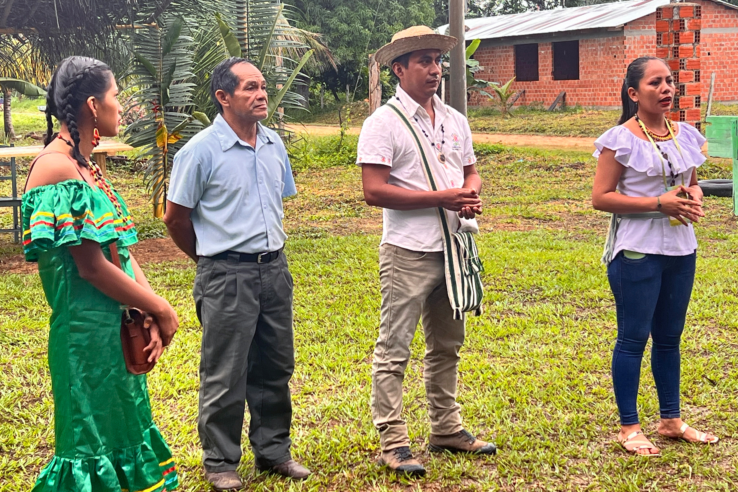 Dario Mamio Serato (center right) greets visitors from across the Amazon in his home village, Bella Altura on June 13. Credit: Katie Surma/Inside Climate News