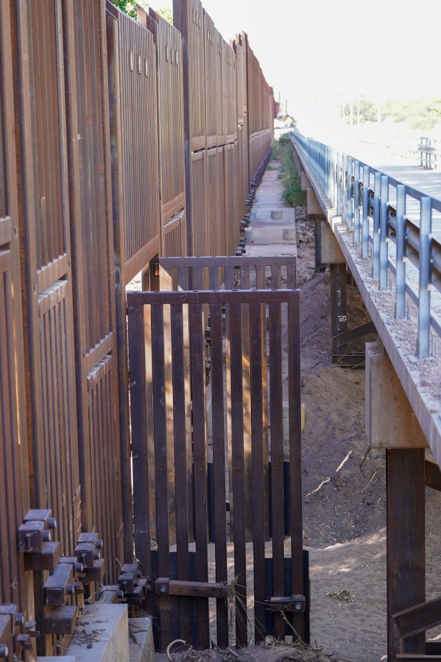 Wide-open flood gates on the border wall