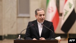 Iran's Foreign Minister Seyed Abbas Araghchi speaks during a joint press conference with his Iraqi counterpart in Baghdad on October 13, 2024.