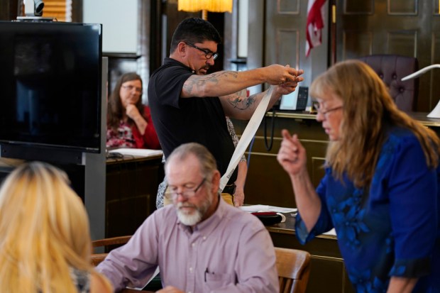 FILE – Esmeralda County Commissioner Tim Hipp, top center, rolls...