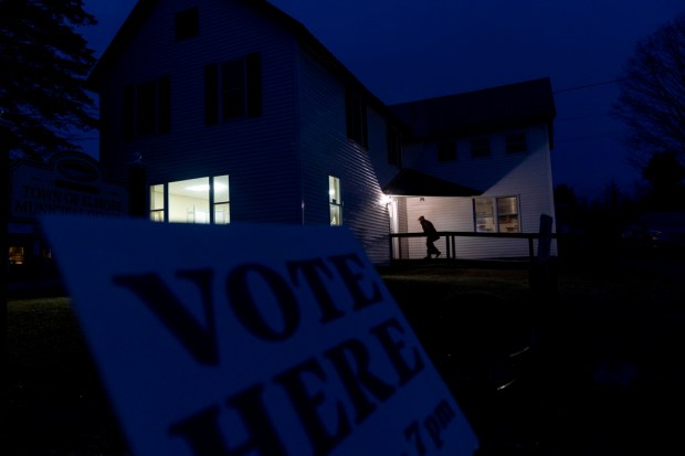 FILE – A voter enters a polling site for the...