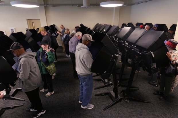 Voters cast their ballots during the first day of in...