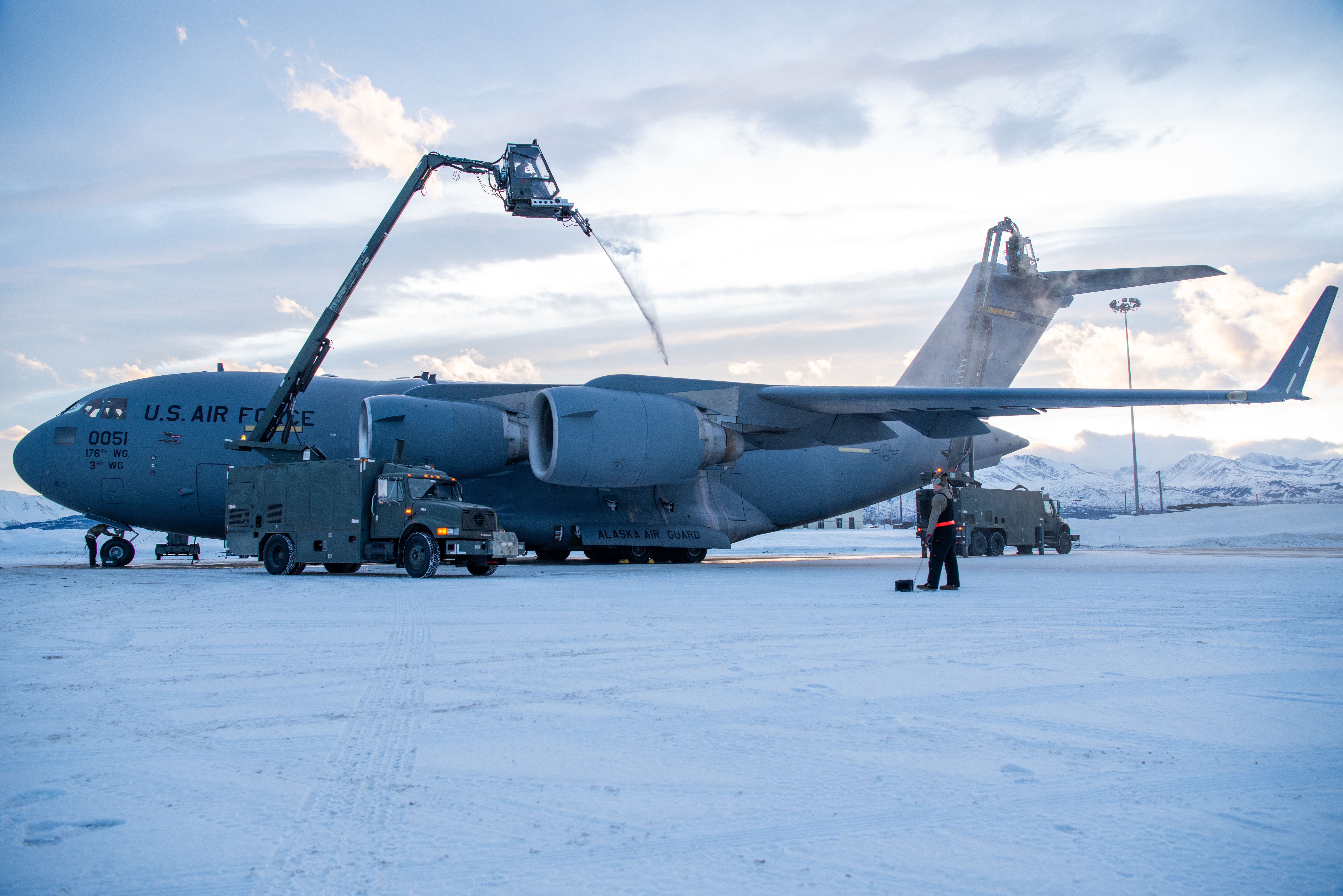 U.S. Air Force Senior Airman Owen Johnson, 703rd Aircraft Maintenance Squadron crew chief, operates the basket of a GL-1800 deicing truck at Joint Base Elmendorf-Richardson, Alaska,