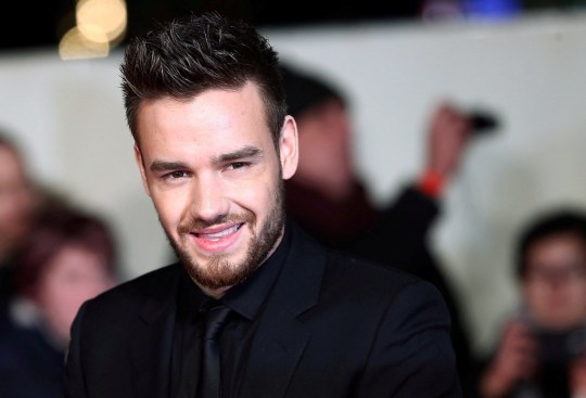 Singer Liam Payne poses for photographers at the world premiere of the film I am Bolt in London, wearing all black