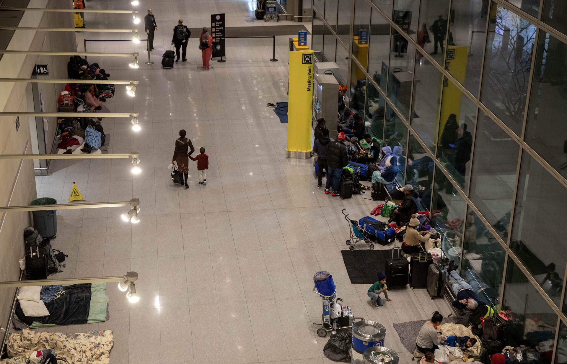 Families without anywhere to stay spend the night at Boston's Logan Airport in January. (Robin Lubbock/WBUR)