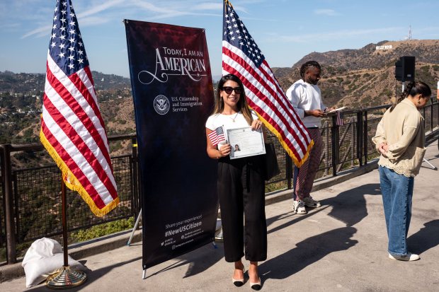 New U.S. Citizen Mireille Koushian poses for a photo after...