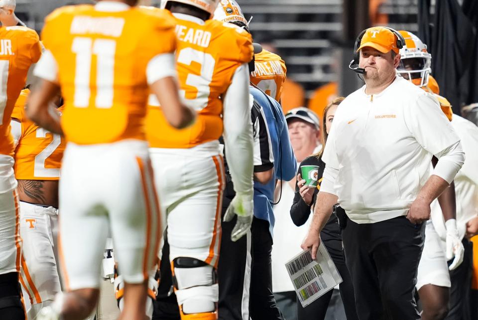 Oct 12, 2024; Knoxville, Tennessee, USA; Tennessee Volunteers head coach Josh Heupel waits for his team to huddle for a time out during a game against the Florida Gators  at Neyland Stadium. Mandatory Credit: Brianna Paciorka/USA TODAY Network via Imagn Images