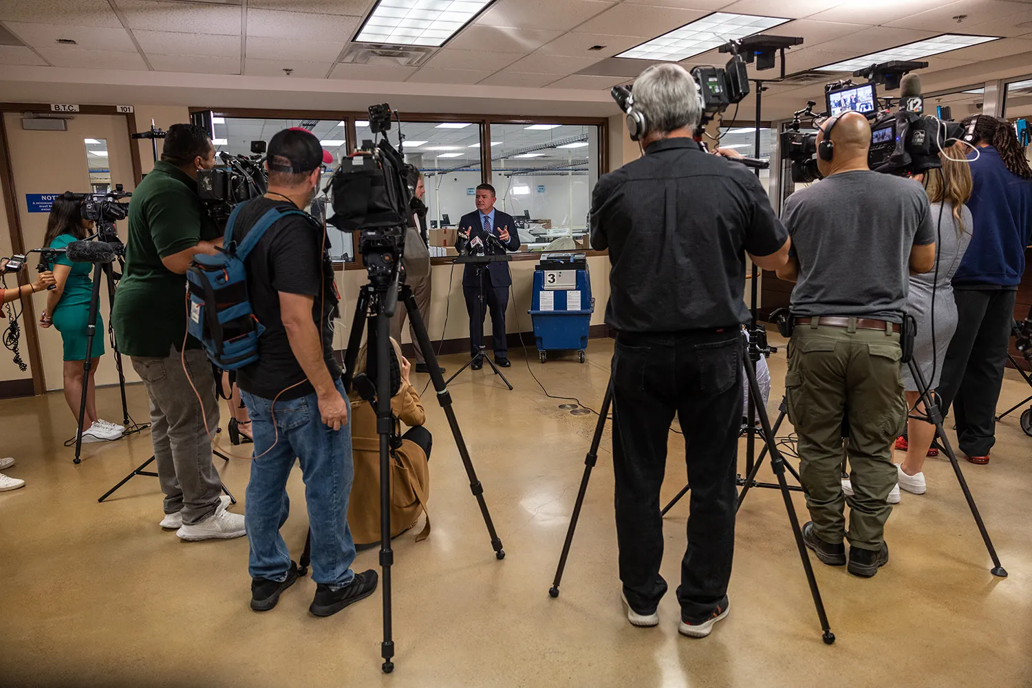 Bill Gates holds a press conference in an election center in Phoenix.