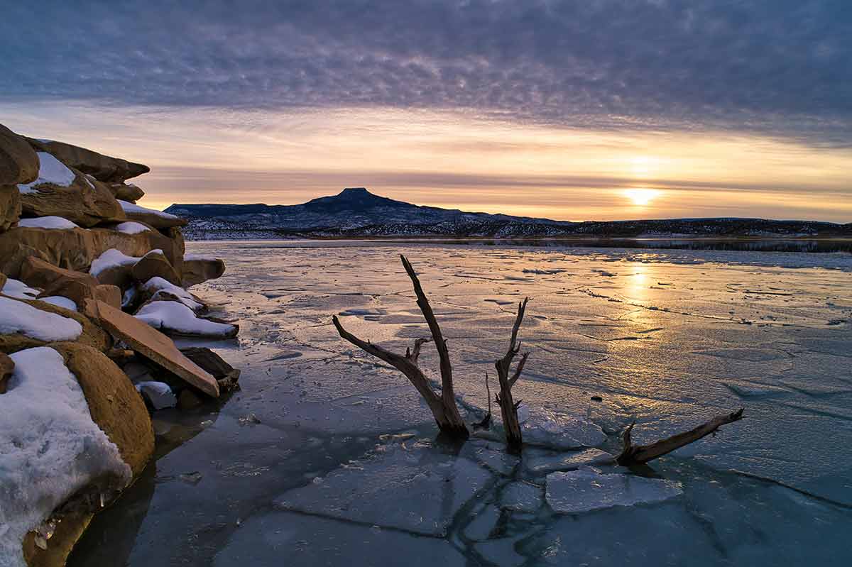 new mexico beaches Lake Abiquiu with sunset view of Cerro Perdanel