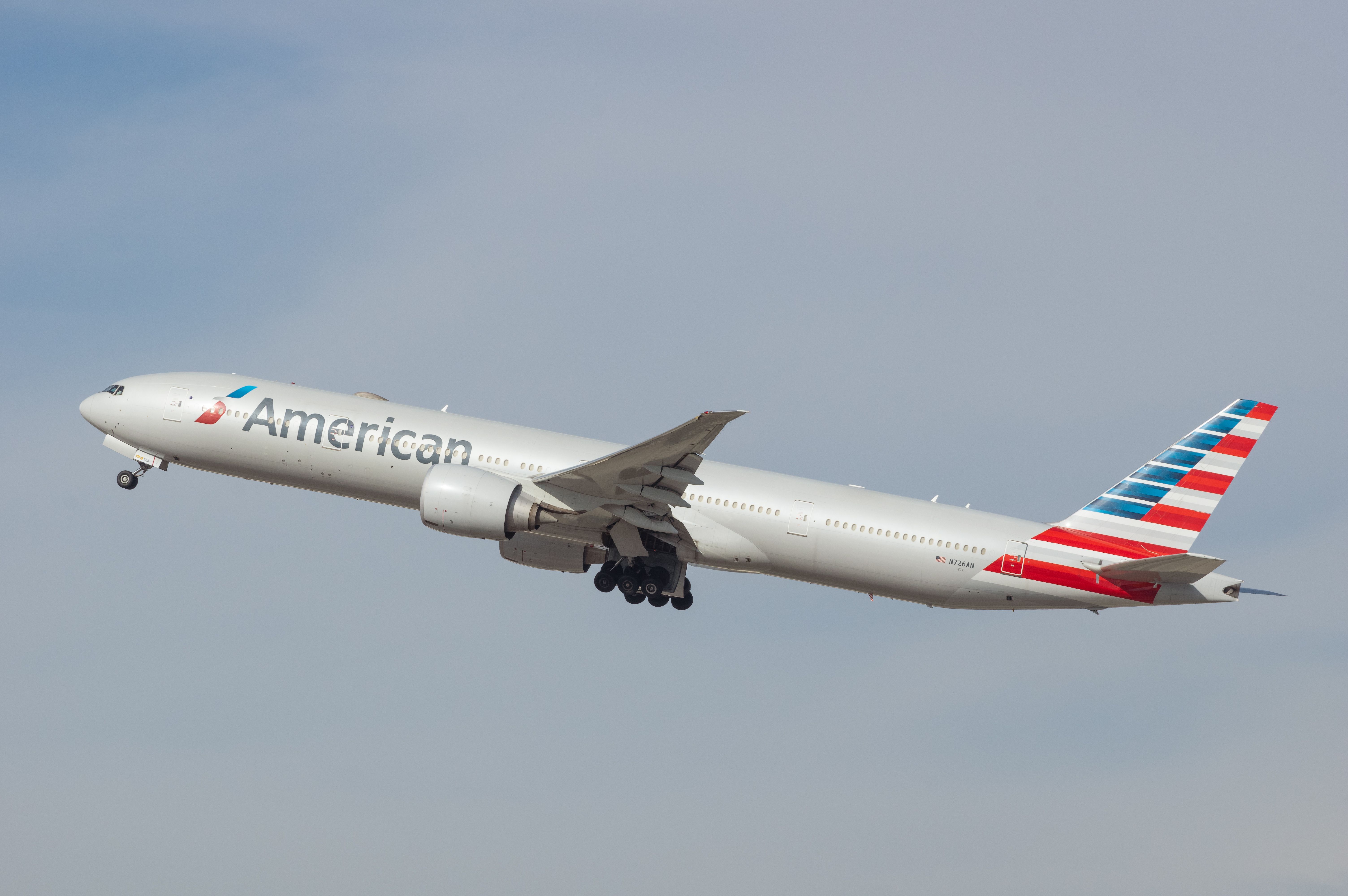 An airborne American Airlines Boeing 777-323(ER) with registration N726AN shown departing from LAX.