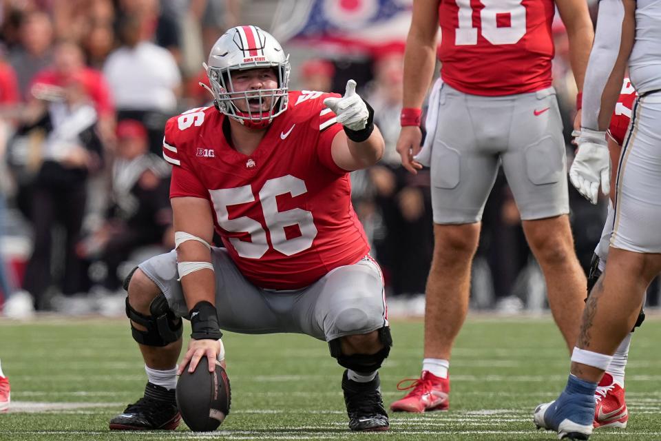 Aug 31, 2024; Columbus, OH, USA; Ohio State Buckeyes offensive lineman Seth McLaughlin (56) motions during the NCAA football game against the Akron Zips at Ohio Stadium. Ohio State won 52-6.