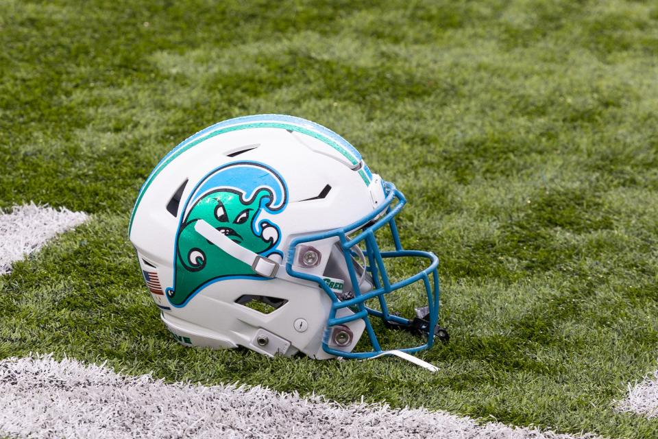 Dec 3, 2022; New Orleans, Louisiana, USA; Tulane Green Wave helmet on the field against the UCF Knights during the first half at Yulman Stadium. Mandatory Credit: Stephen Lew-USA TODAY Sports