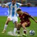 Argentina's midfielder Rodrigo De Paul and Venezuela's midfielder Yeferson Soteldo fight for the ball during the 2026 FIFA World Cup South American qualifiers football match between Venezuela and Argentina, at the Monumental de Maturín stadium in Maturín, Venezuela, on October 10, 2024.