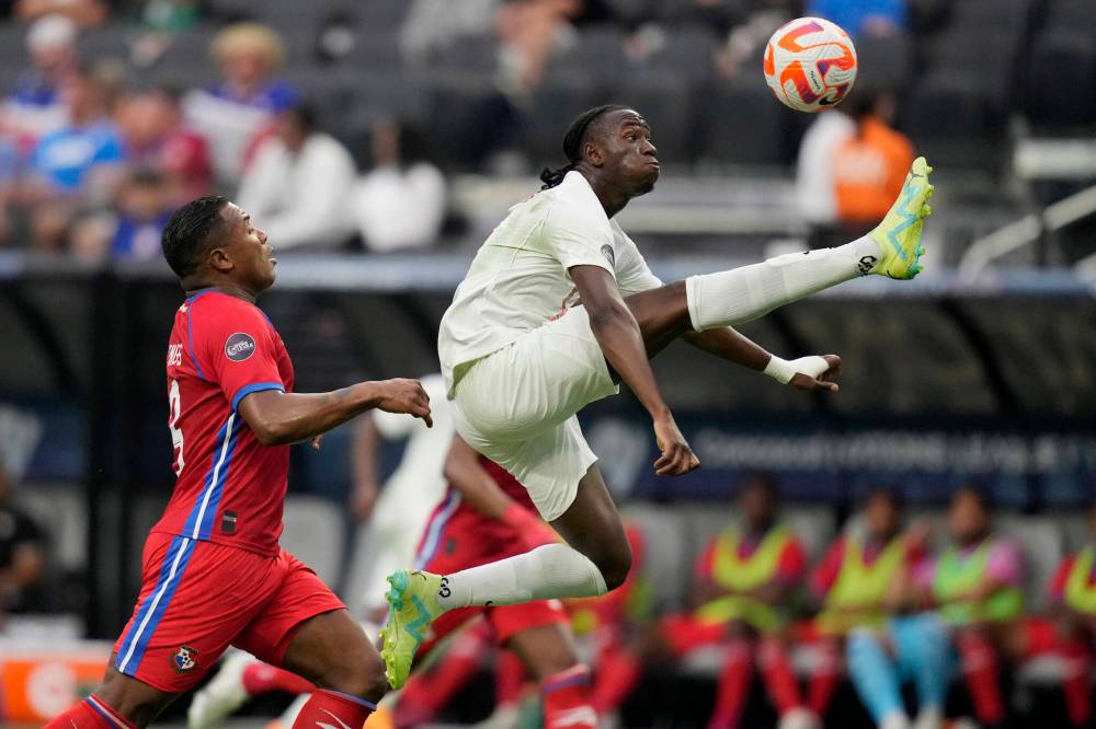 JOHN LOCHER / THE ASSOCIATED PRESS FILES
                                Canada’s Ismael Kone (right) knocks the ball out of the air against Harold Cummings of Panama during a 2023 CONCACAF matchup.