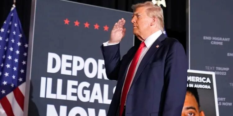 Republican presidential nominee former President Donald Trump salutes at a campaign rally at the Gaylord Rockies Resort & Convention Center, Friday, Oct. 11, 2024, in Aurora, Colo.