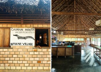 Left: a sign featuring an illustration of a caiman; right: a main lodge building with open walls and a high woven ceiling