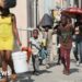 People walk towards a shelter with their belongings fleeing from violence around their homes, in Port-au-Prince, Haiti March 9, 2024