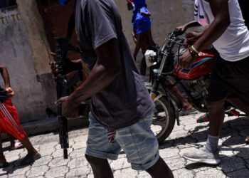 Haiti's gangs luring more children into crime and sexual abuse, HRW says, as 115 people killed in attack