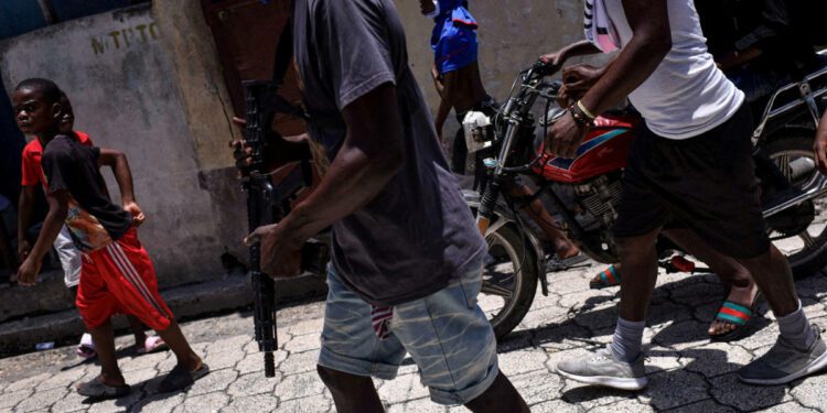 Haiti's gangs luring more children into crime and sexual abuse, HRW says, as 115 people killed in attack