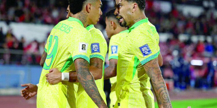 brazil s igor jesus celebrates scoring their first goal with lucas paqueta during the world cup south american qualifiers against chile reuters
