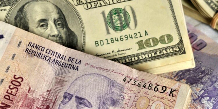 Stacks of 100 Argentine peso notes and US$100 dollar bills.