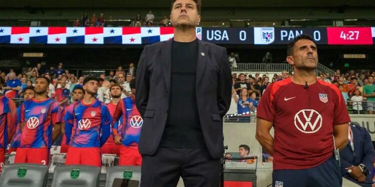 Mauricio Pochettino (center) and his top assistant Jesús Pérez (right) on the U.S. bench during the national anthems before Saturday's game.