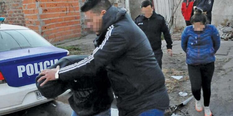 A suspect is arrested by police in Greater Buenos Aires.