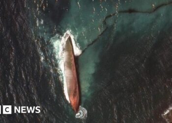 A satellite image shows a close-up view of a capsized barge and an oil spill, off the shore of Tobago Island, Trinidad and Tobago, February 14, 2024.