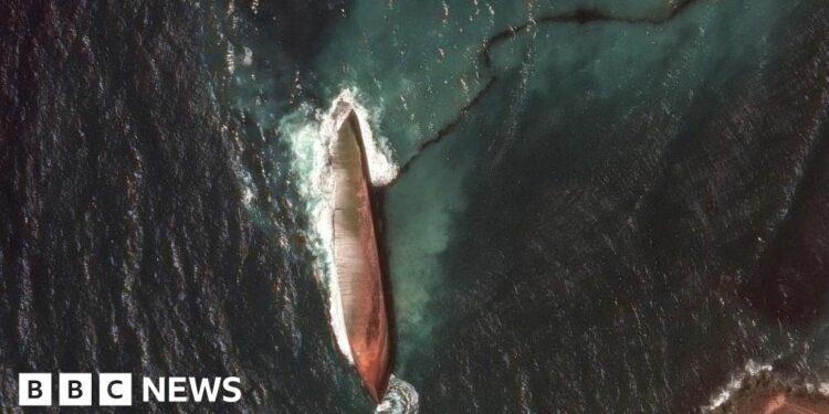 A satellite image shows a close-up view of a capsized barge and an oil spill, off the shore of Tobago Island, Trinidad and Tobago, February 14, 2024.
