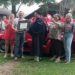 Tyler Huggins, center left, accepts his diploma from Kerry Melton of the College of Engineering while his wife, Anna, to his right, celebrates with other family members in Bono on June 26.