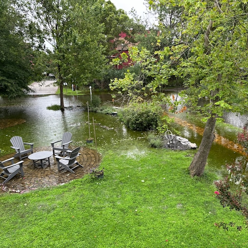 Homeowners in Oyster Harbor are battling frequent flooding, shown here in a photo from a resident, that they say has been exacerbated by drainage work that was never done—along with a golf-cart trail the state deemed illegal.