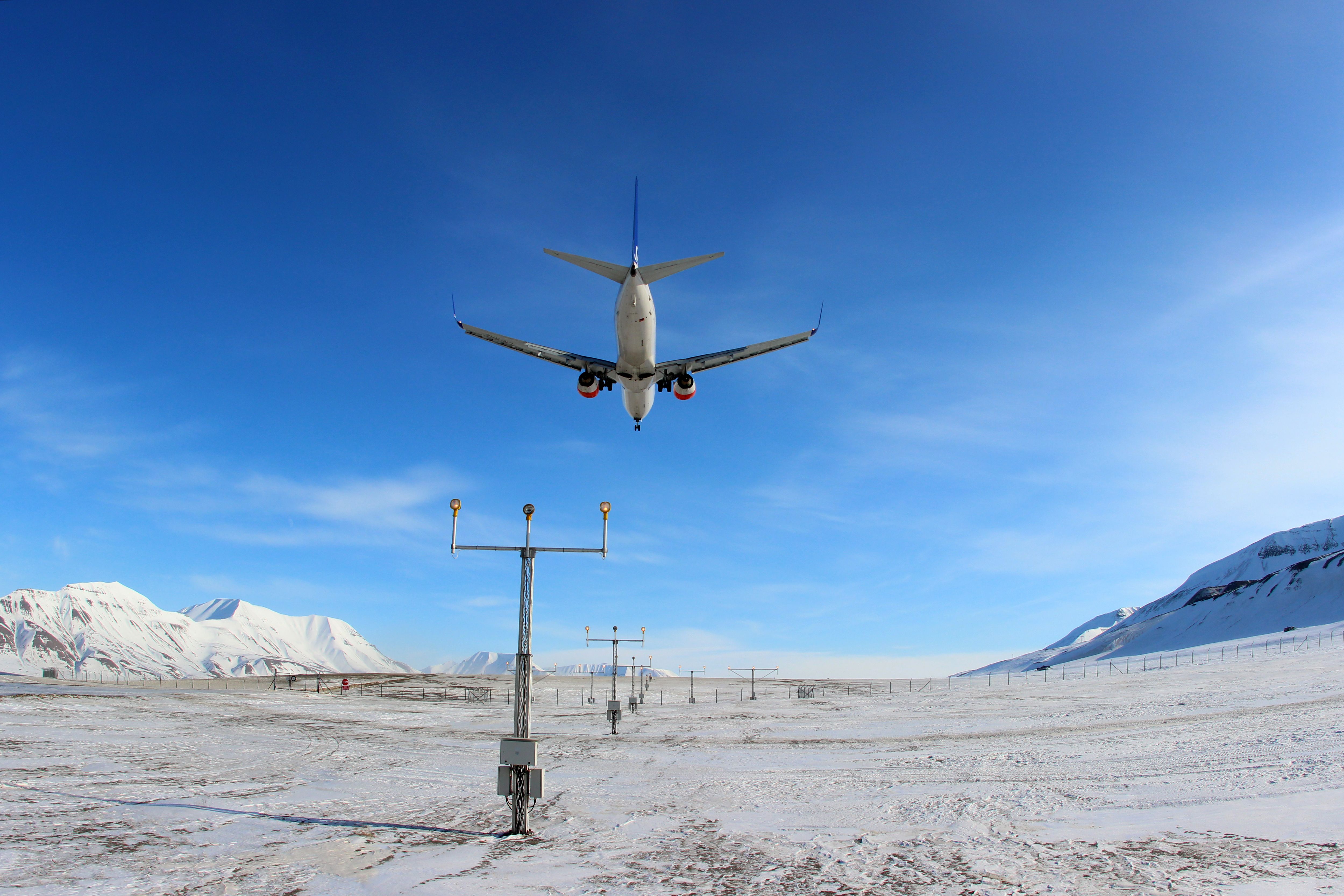 LONGYEARBYEN, SVALBARD, NORVAY - APRIL 19, 2013: SAS - Scandinavian Airlines Boeing 737-800 LN-RRE landing at Svalbard airport.