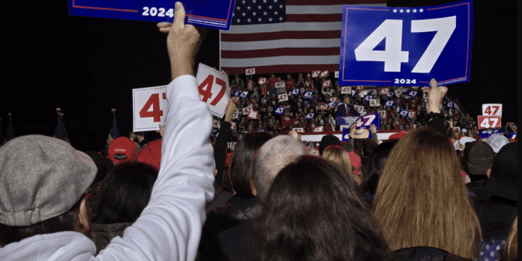 A crowd watches Republican former President Donald Trump speak at a rally in Novi as he campaigns for another term.