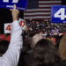 A crowd watches Republican former President Donald Trump speak at a rally in Novi as he campaigns for another term.