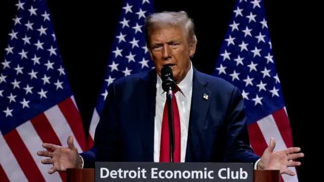 Republican presidential nominee and former US President Donald Trump addresses the Detroit Economic Club in Detroit, Michigan, U.S., October 10, 2024.