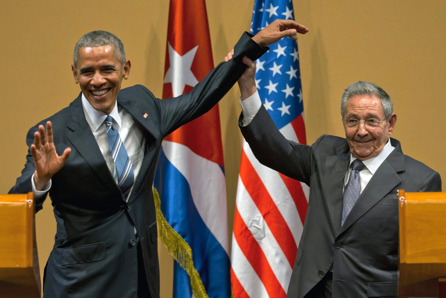 Cuban President Raúl Castro lifted President Barack Obama's arm at the conclusion of their joint news conference in Havana on March 21, 2016.