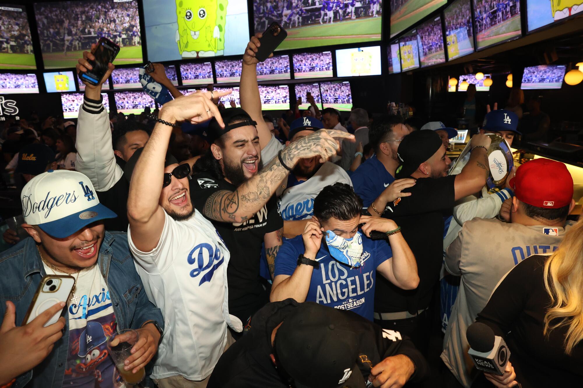 Dodgers fans celebrate as the Los Angeles Dodgers win against the New York Yankees in Game 5