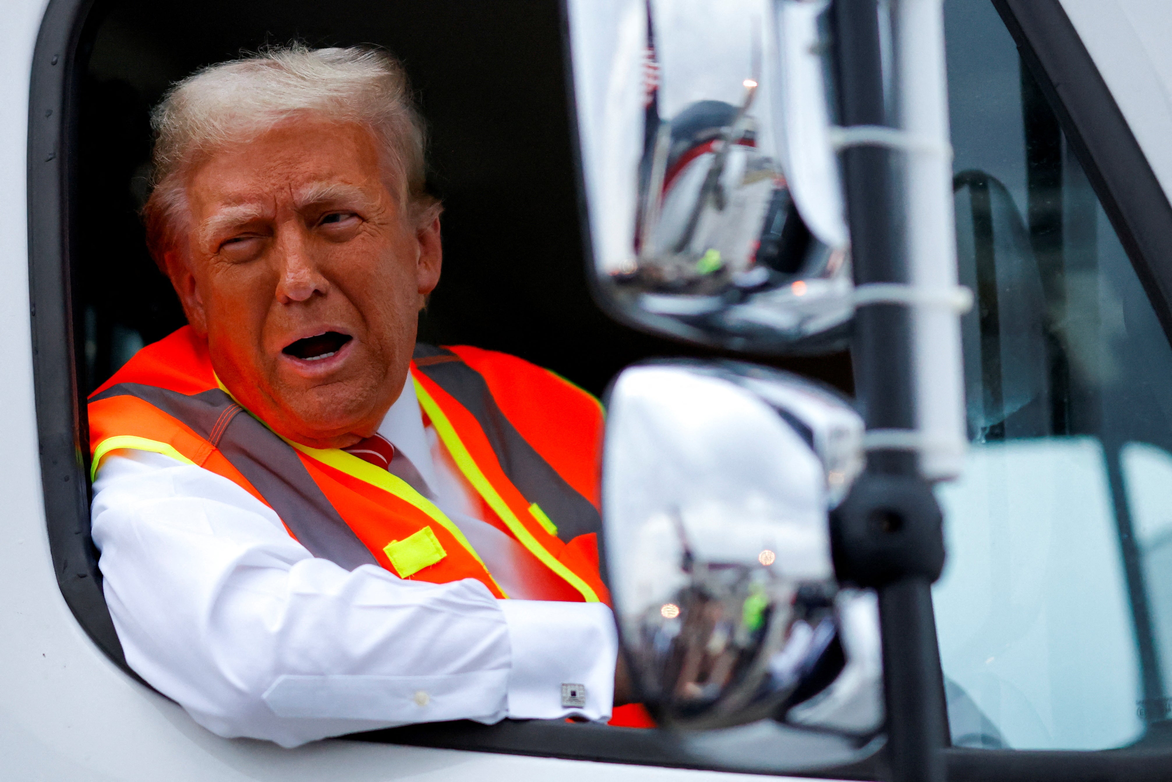 Trump sits in a garbage truck in Green Bay, Wisconsin, on October 30