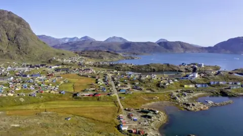 Greenland Minerals Ltd/Handout via Reuters Aerial view of the town of Narsaq in southern Greenland