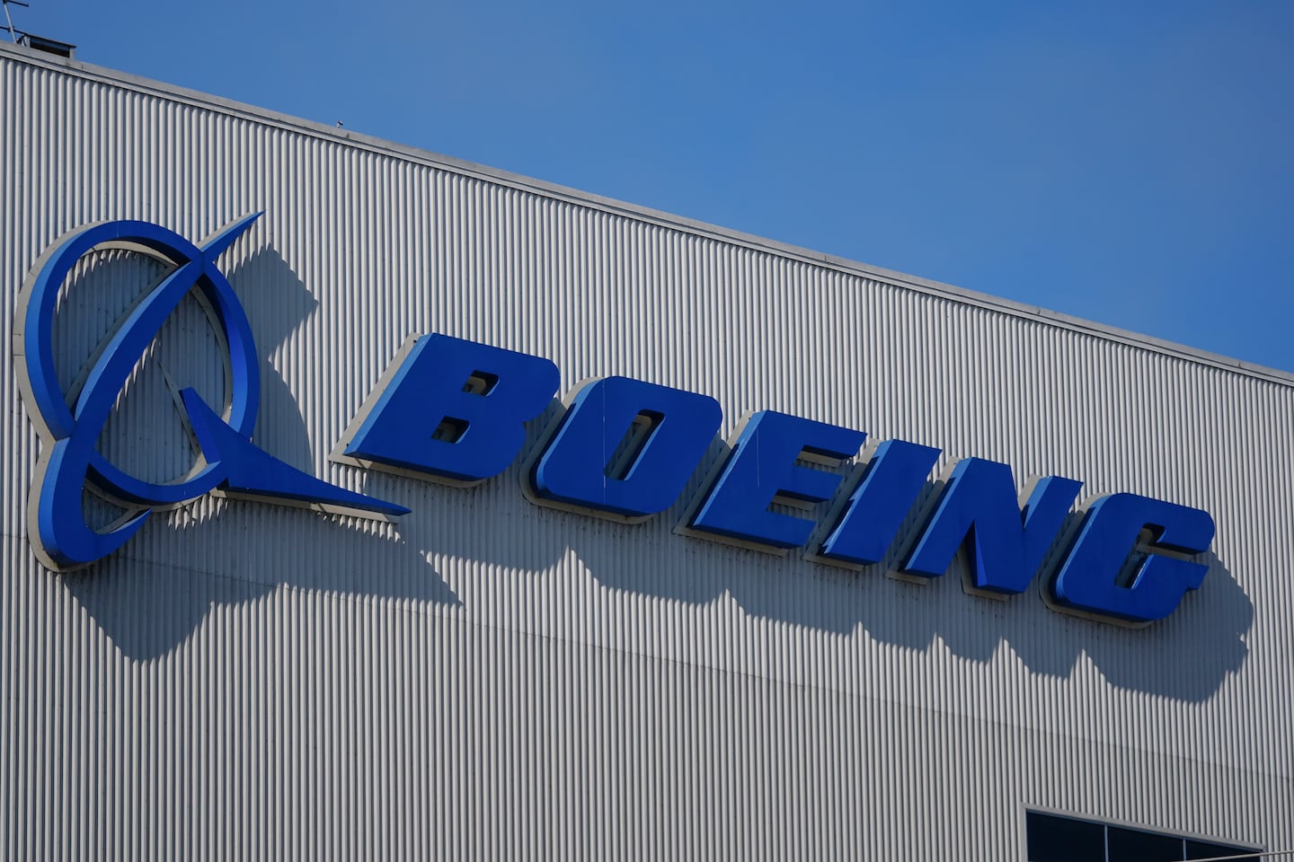 The Boeing logo is displayed at the company's factory on Sept. 24 in Renton, Wash.