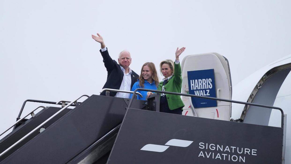 PHOTO: Democratic vice presidential nominee Minnesota Gov. Tim Walz, daughter Hope Walz and wife Gwen Walz wave to supporters before departing from Minneapolis-St. Paul airport, Nov. 4, 2024, in Minneapolis.  (Abbie Parr/AP)